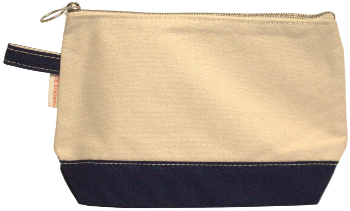 Beige and navy pouch on a beige background