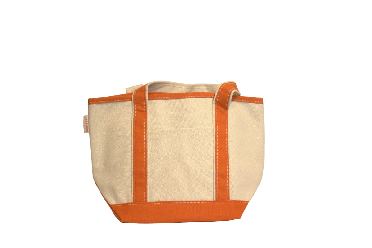 Beige tote bag with orange trim on a beige background