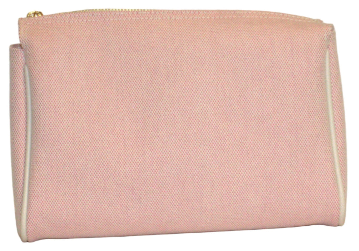 Pink clutch bag on a light beige background